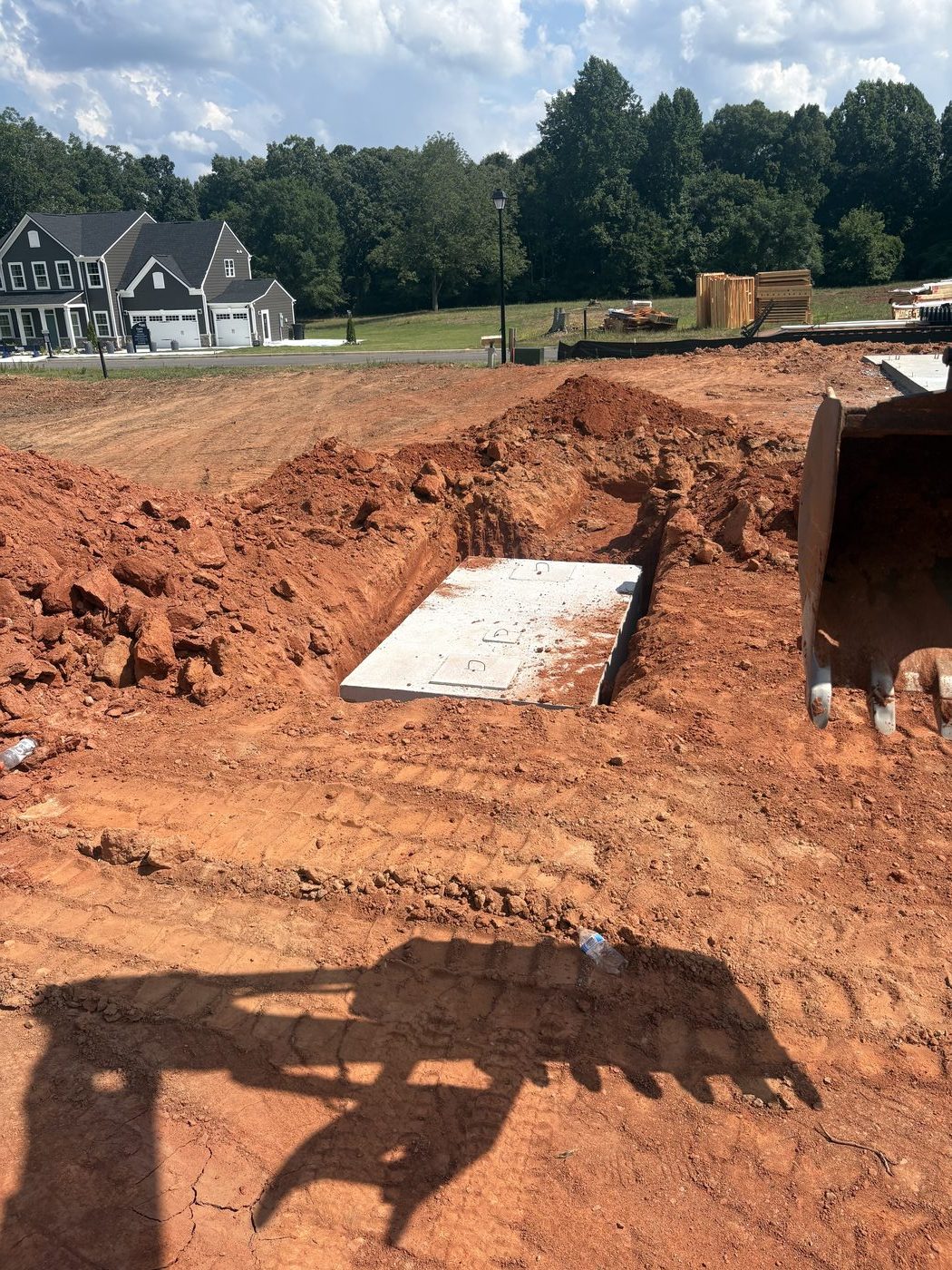 Buried septic tank located and uncovered for inspection by Rapid Rooter